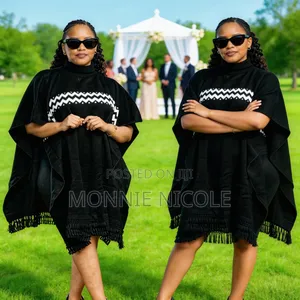 Black Tassel Poncho. Elegant Design