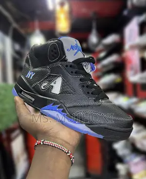 The Nike Air Jordan 5 Retro Awake Ny Black Sneakers.