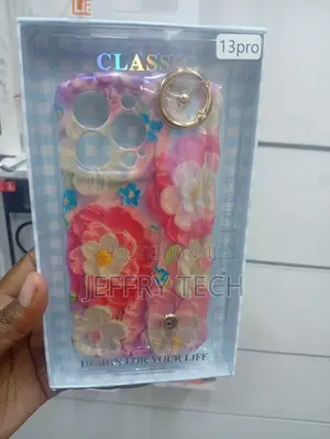 iPhone 13 Pro Case Featuring a Wavy Frame and a Wristband Holder.