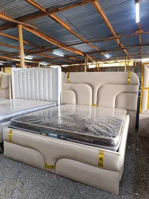 Beige Upholstered 5by6 Bed.