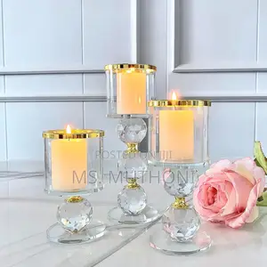 Crystal Pillar Candle Holder Set of Three With Gold-Rimmed Glass Tops.