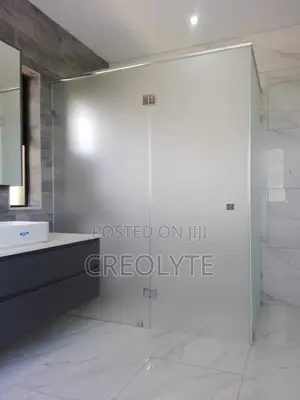 Custom Frameless Shower Enclosure Featuring Frosted Tempered Glass