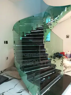 This Modern Helical Staircase and a Curved Glass Balustrade.
