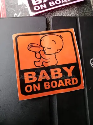 Orange Baby on Board Safety Stickers With Humorous Boss Baby