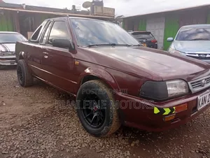 Mazda 323 1996 Maroon
