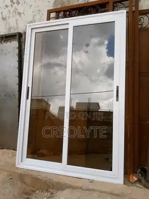 Aluminium Sliding Door— White Frame With Reflective Tinted Glass