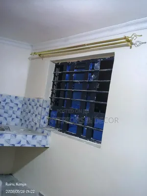 Gold Curtain Rods Double on a White Wall