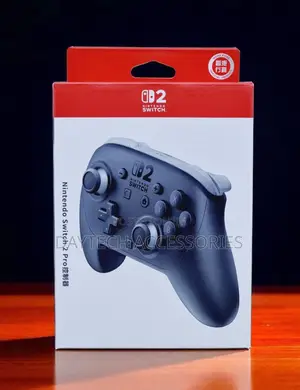 A Nintendo Switch 2 Pro Controller in a White and Red Official Box.