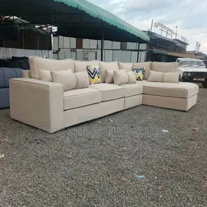 Beige L-Shaped Sofa With Cushions