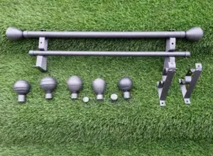 Modern Grey Curtain Rods With End Flowers and Wall Brackets