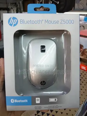 This Is an Hp Bluetooth Mouse Z5000 Featuring a Sleek Silver Design.