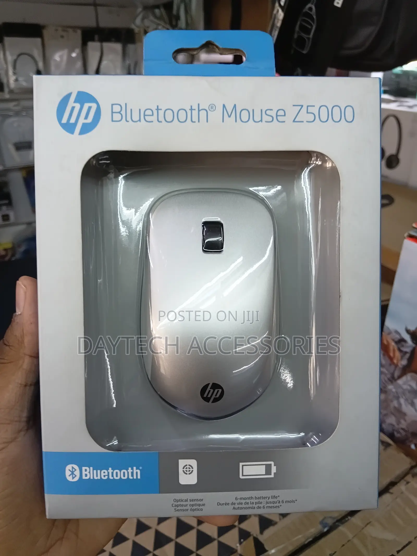 This Is an Hp Bluetooth Mouse Z5000 Featuring a Sleek Silver Design.