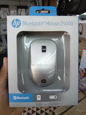 This Is an Hp Bluetooth Mouse Z5000 Featuring a Sleek Silver Design.