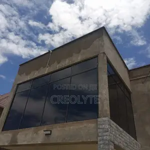 Corner Aluminium Fixed Windows – Dark Frame Tinted Glass