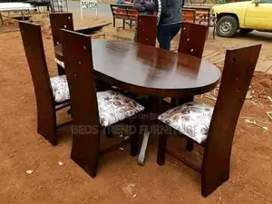 6-Seater Oval Wooden Dining Set With Floral Cushioned Chairs