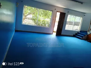 A Total Floor Over Blue Indoor Wall to Wall Carpets