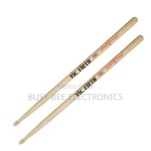 A Set of 2 5a Walnut Drumsticks, Perfect for Jazz Drummers.