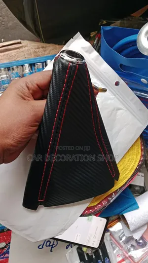 Carbon Fiber Shift Boot Cover With Prominent Red Stitching