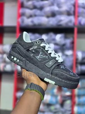 Louis Vuitton Lv Trainer Sneakers in a Black Monogram Denim Colorway.