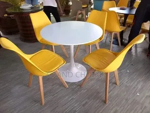 Modern Round Marble Dining Table With Padded Eames Chair