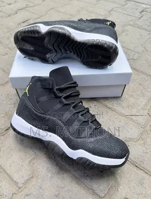 Nike Air Jordan 11 Retro Featuring a Unique Black Textured Mudguard