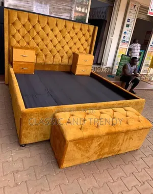 King Size Bed With Bedside Drawers and an Ottoman