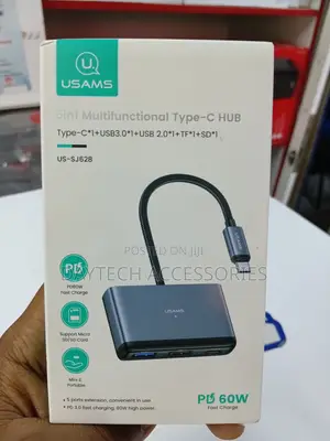 This Is a Usams Us-Sj628 5-in-1 Multifunctional Type-C Hub in a Gray.
