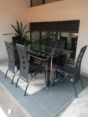 Executive 6 Sitter Glass Dinning Table With Leather Seat