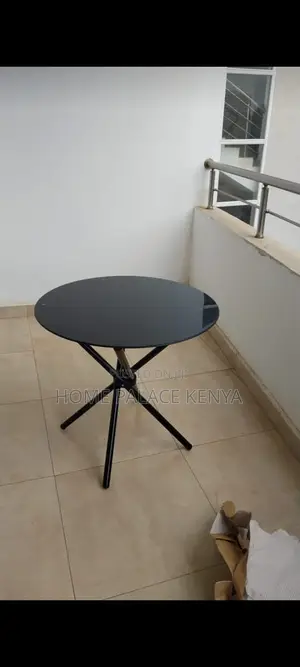 Dining Table: Circular Glass Table With Tripod Base for Two