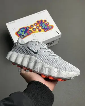 Nike Mind 002 Pregame Shoes in a Light Smoke Grey
