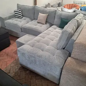 6-Seater Light Grey Tufted L-Shaped Sofa With Footrest