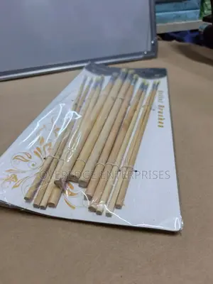 Artist Painting Wooden Brushes