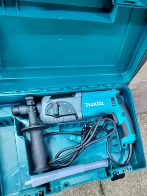 Makita Hr2470 15/16" (24mm) SDS-Plus Rotary Hammer Drill.
