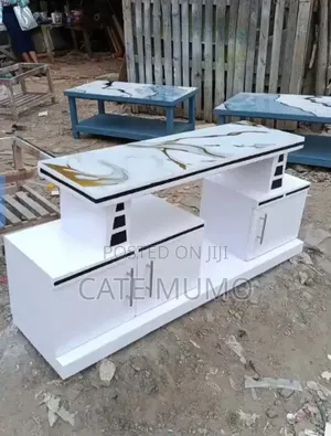 A Tv Stand With Mable Top