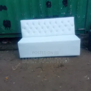 White Couch With Polished Wood Legs