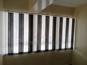 Brown and White Vertical Window Blinds