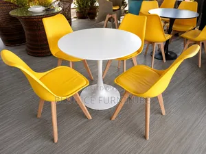Round Dining Table and Padded Eames Chair
