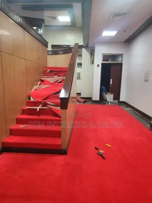 Wall to Wall Red Carpets on Stairs During Installayion