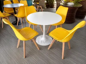 Round Dining Table and Padded Eames Chair
