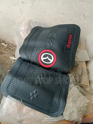 Floor Mats With Prominent Mazda Logo in a Red Circular Frame