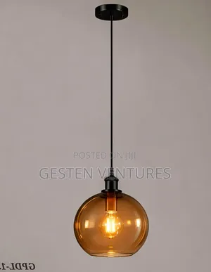 Amber Glass Globe Shade and a Black Metal Finish Pendant Light