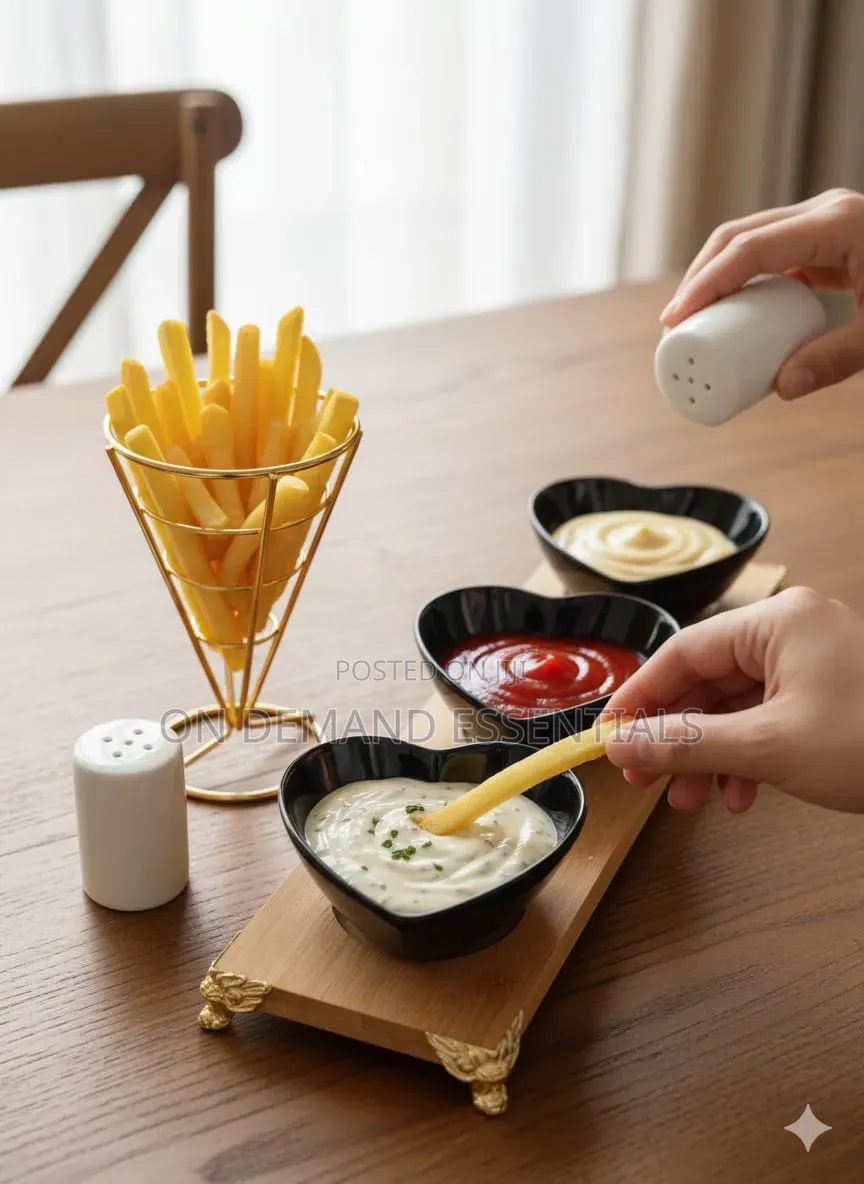 Three Heart-Shaped Black Ceramic Bowls on a Bamboo Tray