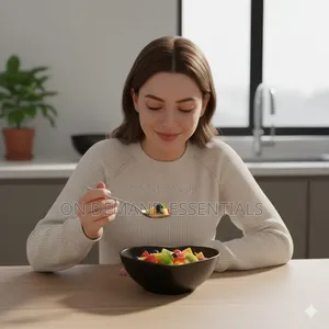 Three Heart-Shaped Black Ceramic Bowls on a Bamboo Tray