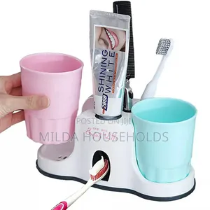 Toothbrush Holder With Toothpaste Dispenser.