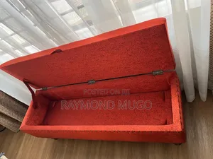Rust Upholstered Storage Ottoman