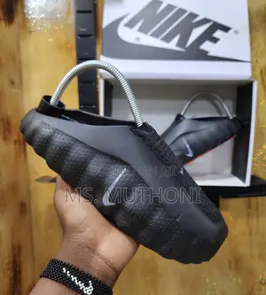 Boxed Innovative Massage Sole and a Chunky Profile Nike Mind Slides