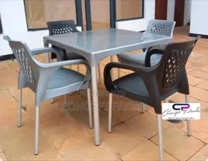 Plastic Table + 4 Chairs With Metallic Legs.