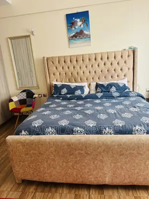 6 X 6 Fabric Bed With a Padded Headboard.