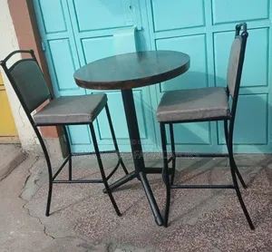 Bar Table Set With a Patterned Wooden Top.