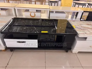 This Modern Coffee Table Sleek Black Marble-Patterned Glass Top